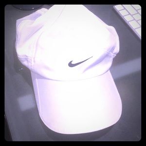 White nike  feather light dri fit hat women’s
